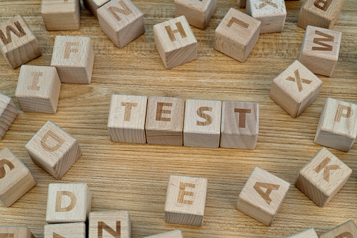 Wooden blocks with word test.