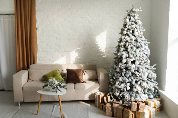 istock Beautiful holdiay decorated room with Christmas tree with presents under it 1292748382