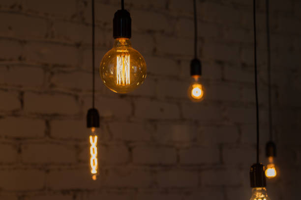 istock Edison vintage lamp on a dark background 1292749908