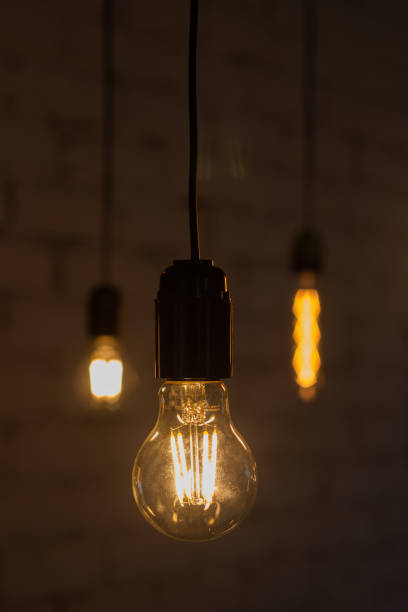 istock Edison vintage lamp on a dark background 1292749937