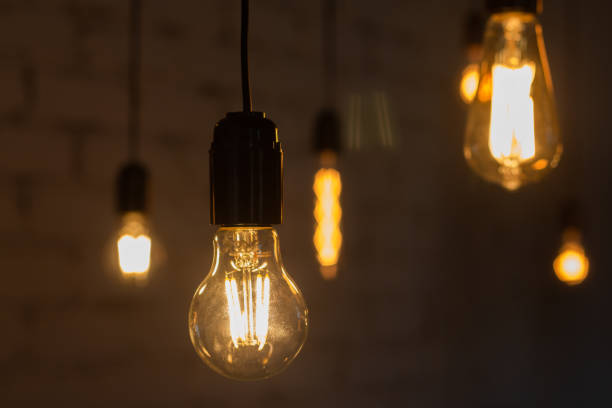 istock Edison vintage lamp on a dark background 1292749968