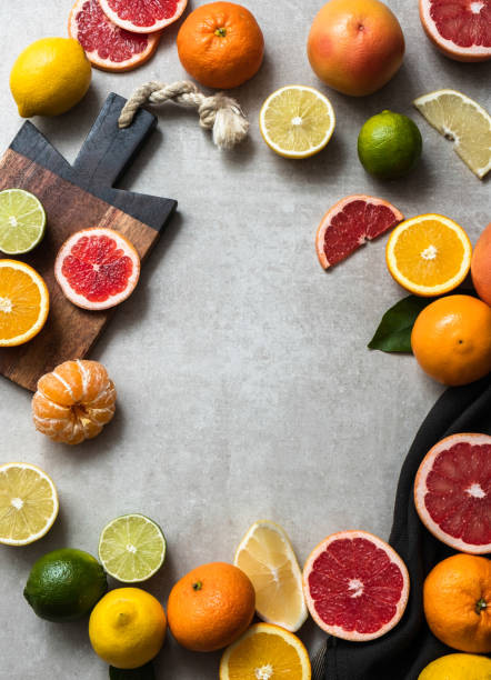 Fresh fruit on the kitchen table Organic citrus fruit including lime, lemons, orange, yellow grapefruit, pink grapefruit and tangerines on cement desk in kitchen table.
No plastic, zero waste,  sustainable lifestyle  concept. healthy eating red above studio shot stock pictures, royalty-free photos & images