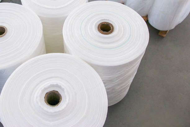 istock The roll of material for plastic bag manufacturing process. The plastic bag in the roll 1292750655