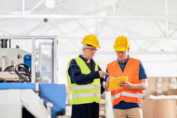 istock An engineer and a manager working together in a factory, wearing protective wear 1292750926