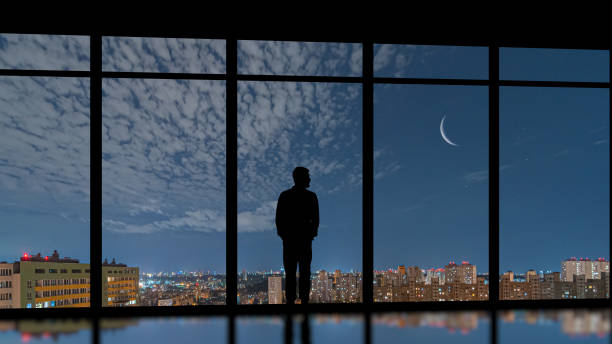 istock The man standing near the panoramic window on a moon background 1292750984