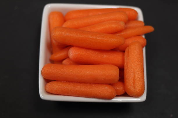 istock Cut and peeled baby carrots 1292751400