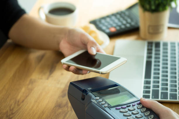 istock cafe making show transfer payment through smartphone app Mobile shoppingwith NFC technology on virtual onlineshop 1292753591