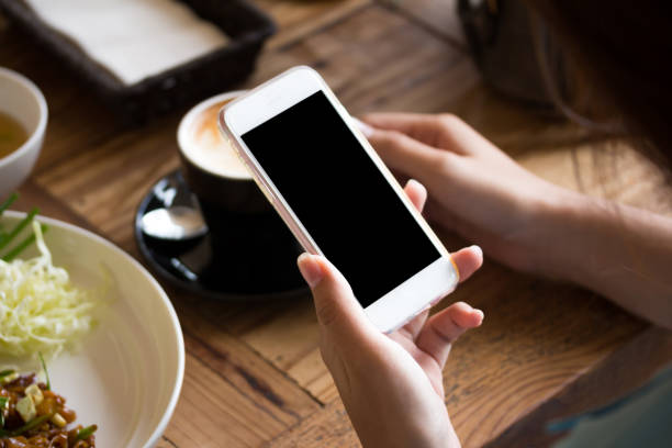 istock cafe making show shopping transfer payment through smartphone app Mobile Payment with NFC technology on Smartphone shopping online 1292754294