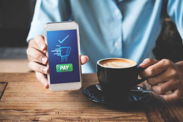 istock Client of cafe making show transfer payment through smartphone app Mobile Payment with NFC technology on Smartphone shopping online 1292754299