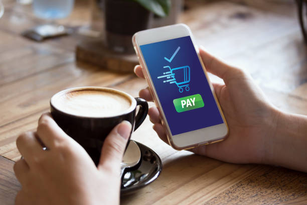istock cafe making show shopping transfer payment through smartphone app Mobile Payment with NFC technology on Smartphone shopping online 1292754301