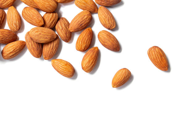 istock Almonds floating pieces on white isolated .almond  Image stack Full depth of field macro shot 1292754332
