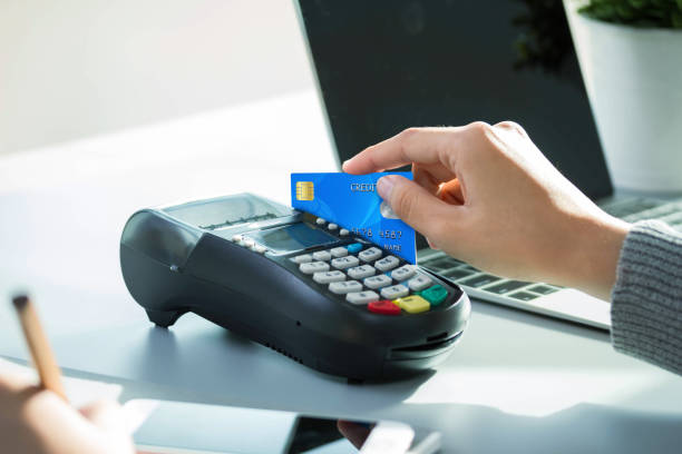 istock hands holding credit card typing numbers on computer keyboard while sitting at home at 1292754997