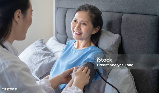 Checking Elderly Patient Bp Heart Rate Digital Pulse Stock Photo - Download Image Now