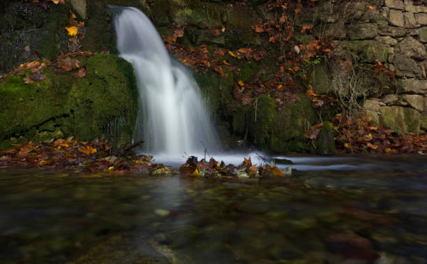istock A small waterfall at autumn in jena germany europe 1292755404