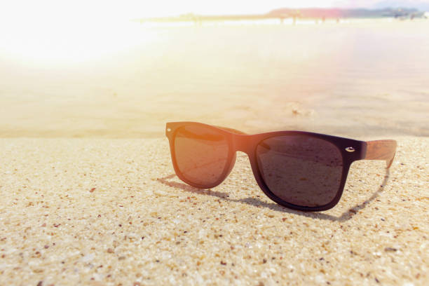 istock sunglasses on beach in summer 1292755442