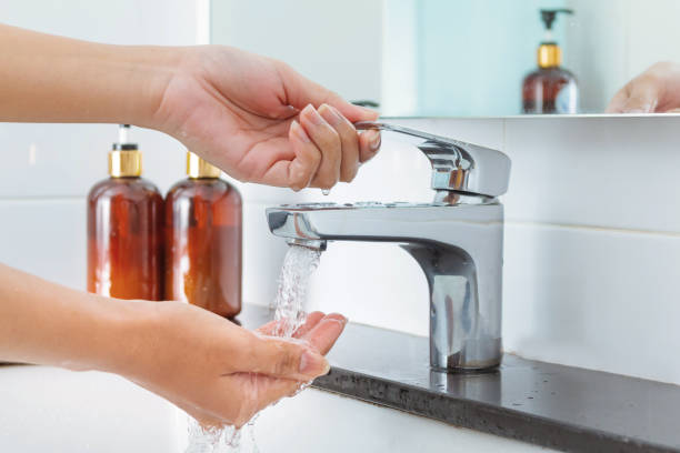 istock Hand use water tap cleaning  bacteria before eating 1292755448