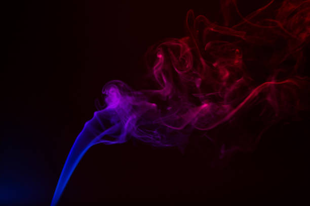 istock Colorful smoke close-up on a black background 1292755586