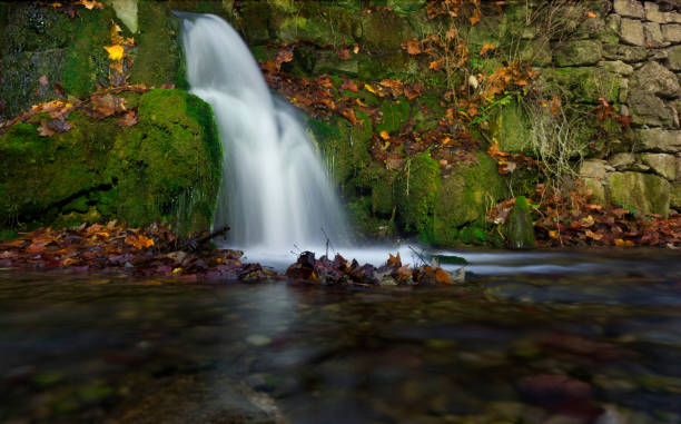 istock A small waterfall at autumn in jena germany europe 1292755668