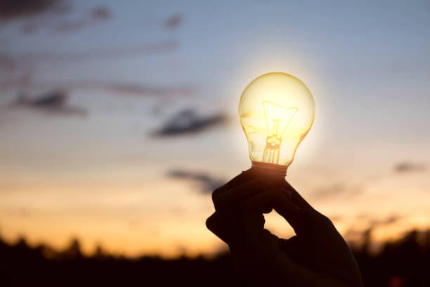 istock women holding light bulbs,creative idea  innovation with  technology in sunset time 1292755672