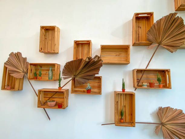 istock White wall decorated with wooden boxes to place things. 1292755930