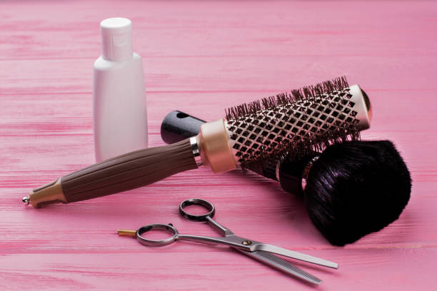 istock Hairbrush, scissors and shampoo. 1292756290