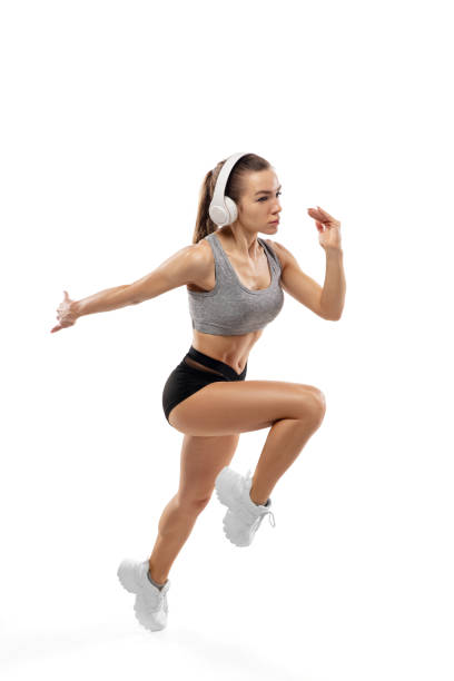 istock Caucasian professional female runner, athlete training isolated on white studio background. Copyspace for ad. 1292756808