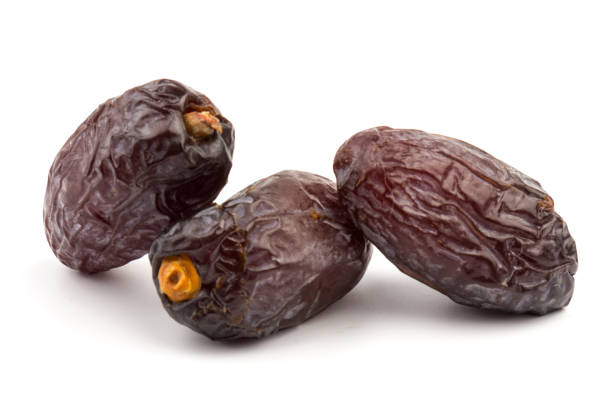 istock Dried dates fruits isolated on white background 1292756898