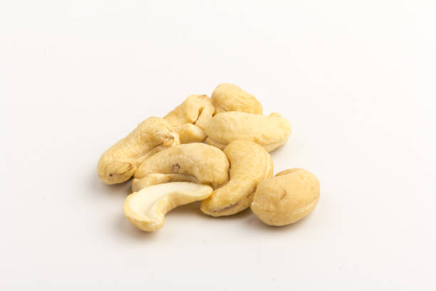 istock Raw cashew nuts isolated on white background. 1292756915