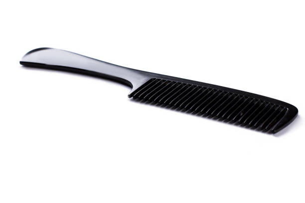 istock Black plastic hair comb on white background. 1292756956