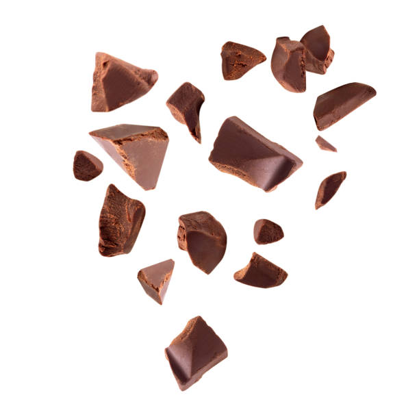 istock Milk chocolate pieces on  white isolatedchocolate.  Clipping Path Image stack Full depth of field macro shot 1292757658
