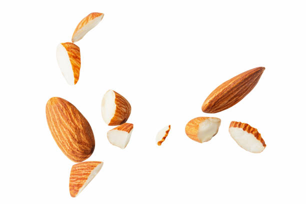 istock Almond pieces sliced explosion.almond Clipping Path on white isolated.Image stack Full depth of field macro 1292758174