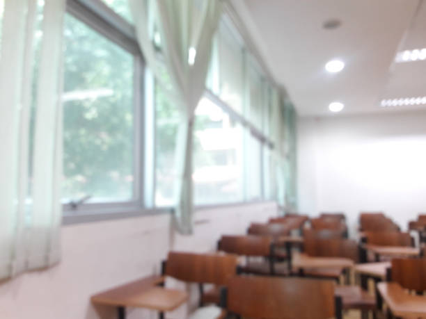 istock School classroom in blur background without young student; 1292758481