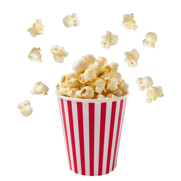 istock Popcorn viewed float Paper cup with popcorn on white isolated 1292758777