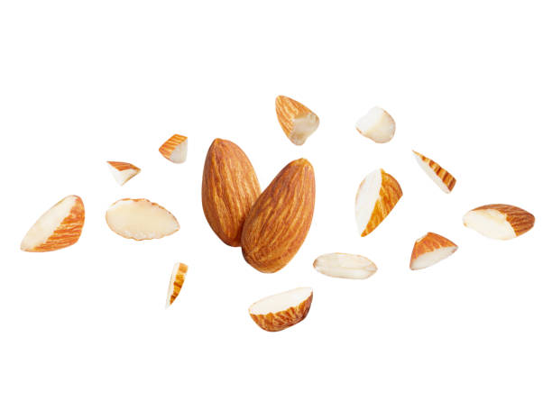 istock almond pieces explosion on white isolated. almond Clipping Path  .Image stack Full depth of field macro 1292758950