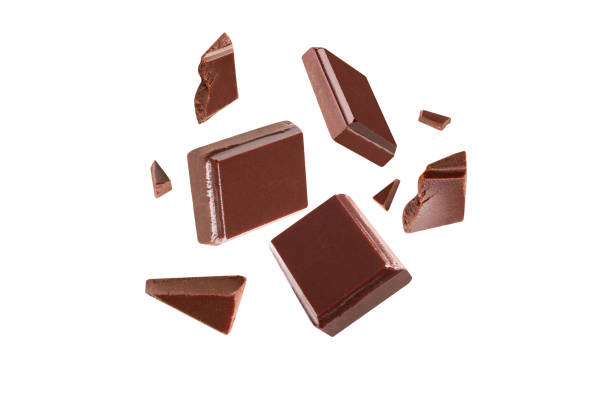 istock chocolate broken pieces in the air on a white background .Clipping path 1292758965