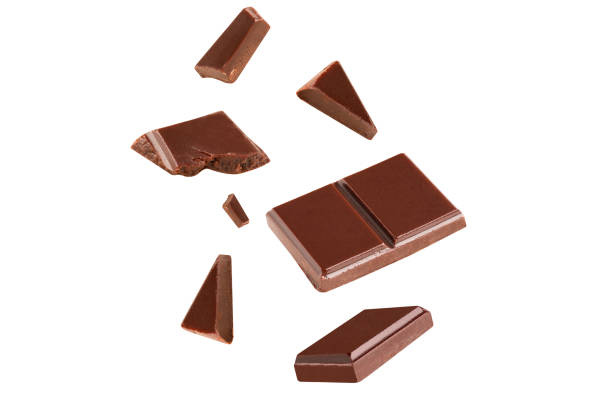 istock falling chocolate broken pieces in the air on a white background .Clipping path 1292758979