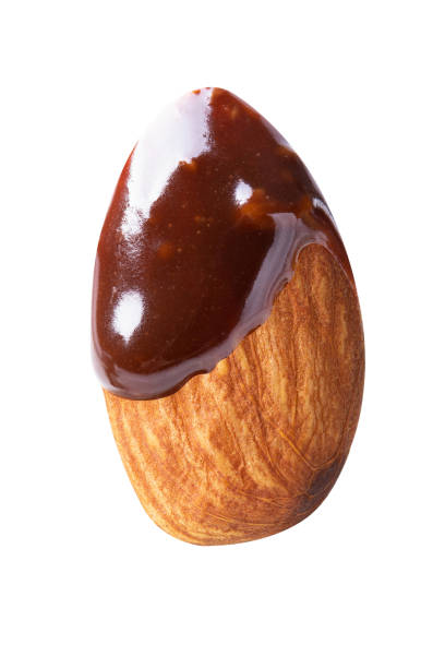 istock almond chocolate blast fly chocolate nuts isolated on white isolated 1292759005