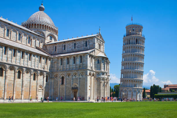 istock leaning pisa tower and baptistery with meadow and blue sky 1292762022