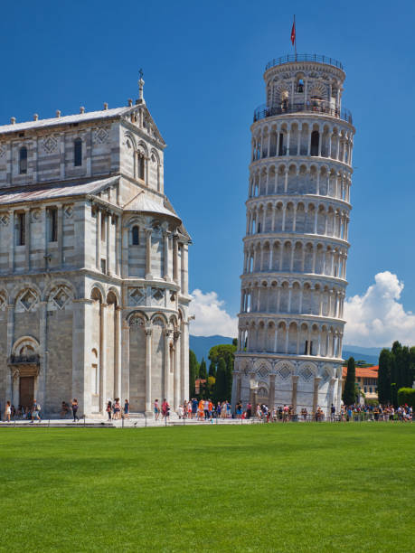 istock leaning pisa tower and baptistery with meadow and blue sky 1292762205