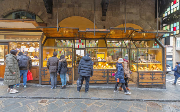 Florence, Italy - February 2, 2018: Tourists Shoppers in Front of Luxury Watch and Jewellery Store at Ponte Vecchio in Florence, Italy.