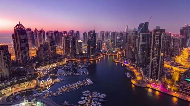 istock Dubai marina harbor panorama from night to day transition timelapse 1292764294