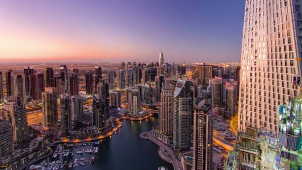 istock Dubai marina harbor from night to day transition timelapse 1292764350