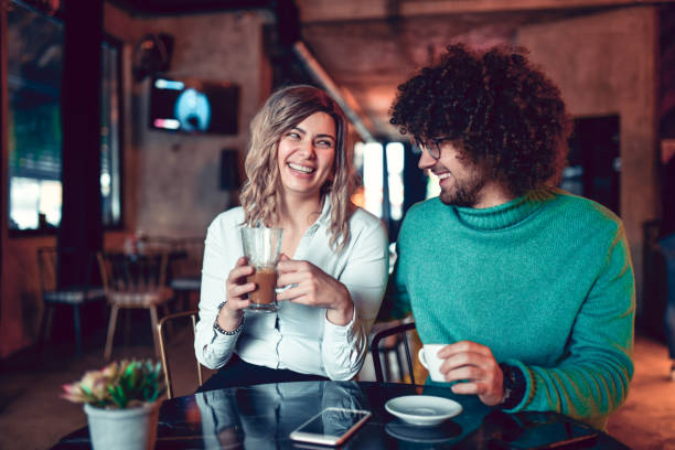 istock Smiling Couple Enjoying Time Spent Together During Coffee Date 1292765976