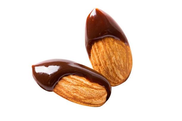 istock almond chocolate blast fly chocolate nuts isolated on white isolated 1292766166