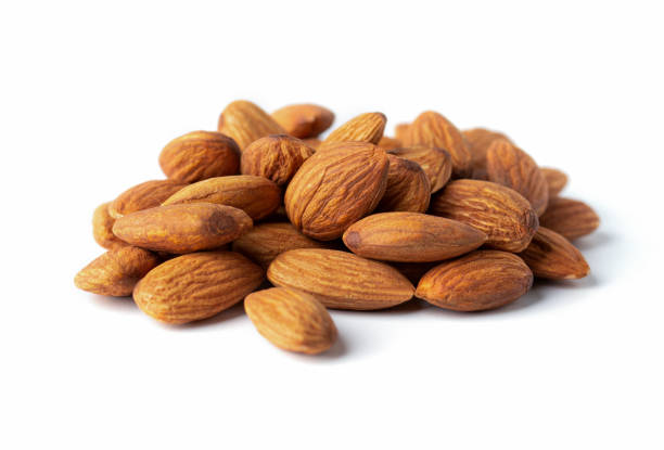 istock full almond nut on white isolated with clipping path 1292766173
