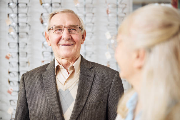 istock Handsome spectacled elderly man smiling at his wife 1292767063