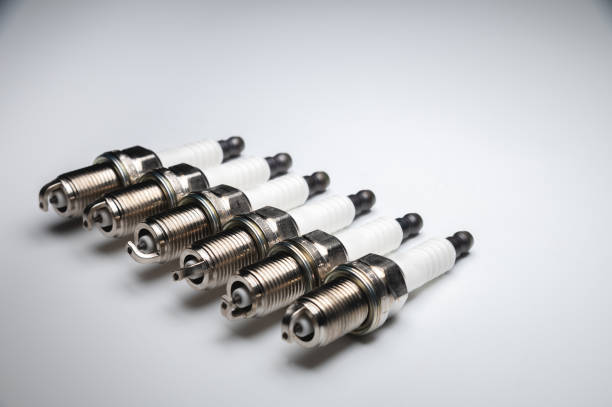 istock Six new ICE spark plugs on a gray background in contrasting light 1292768149