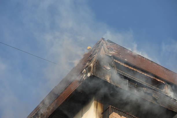 istock Firefighters On Flaming building Roof 1292769411