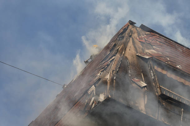istock Firefighters On Flaming building Roof 1292769422