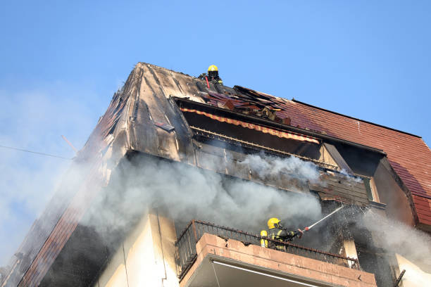istock Firefighters On Flaming building Roof 1292769445